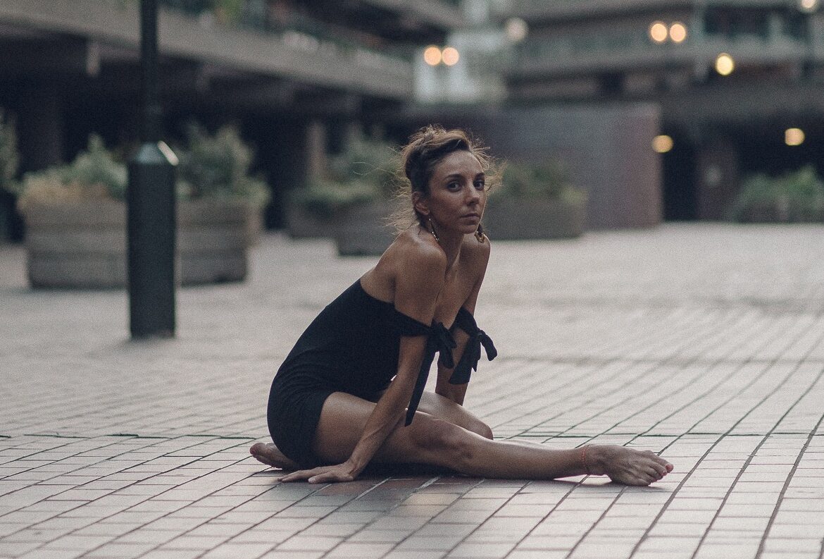 Kate Lyons posing as a barefoot ballerina at the Barbican, London. Photo by Pedestrians on Pointe - Alex Fine