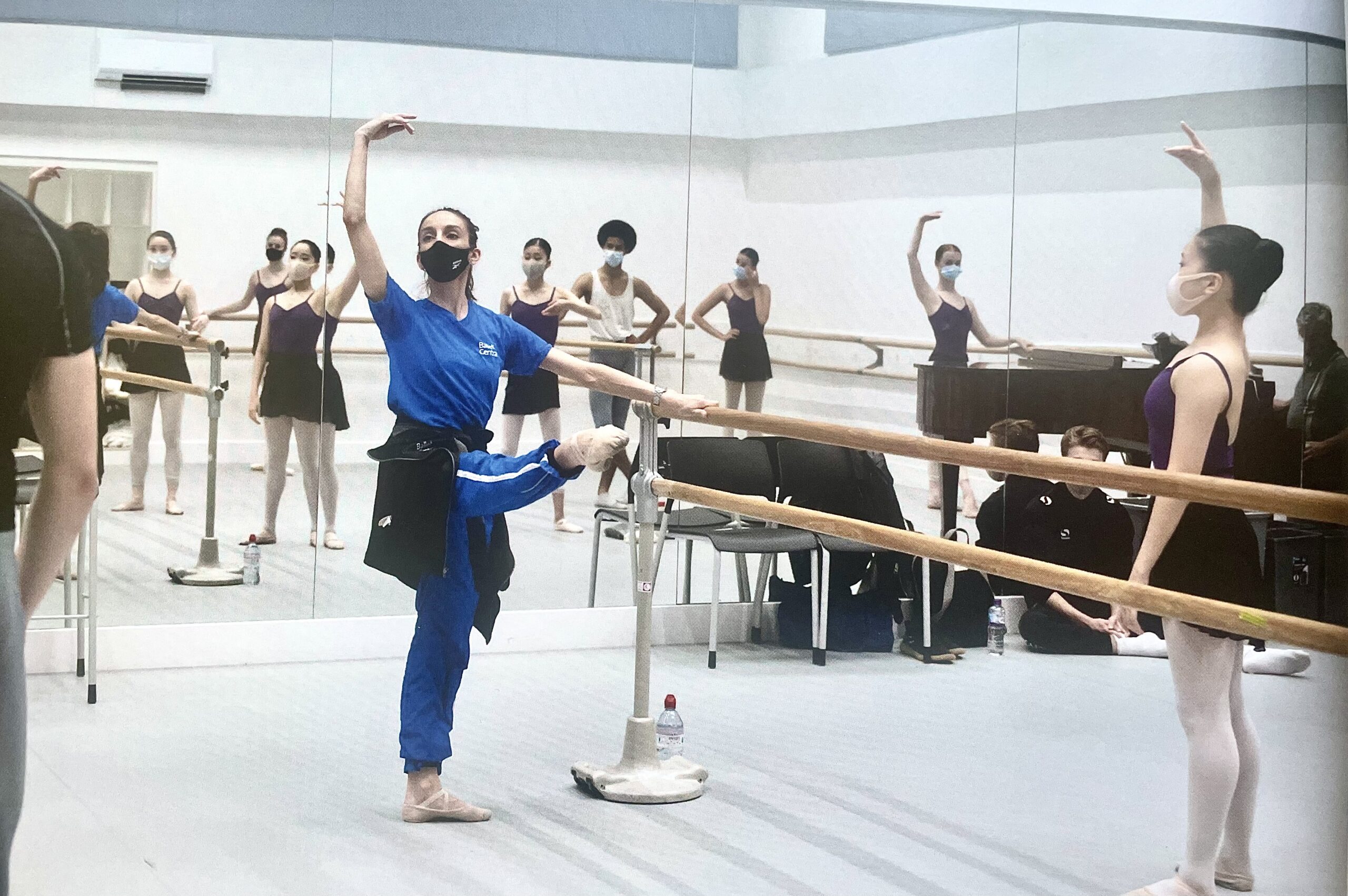 Kate Lyons demonstrating develop devant at the barre in class at Central School of Ballet