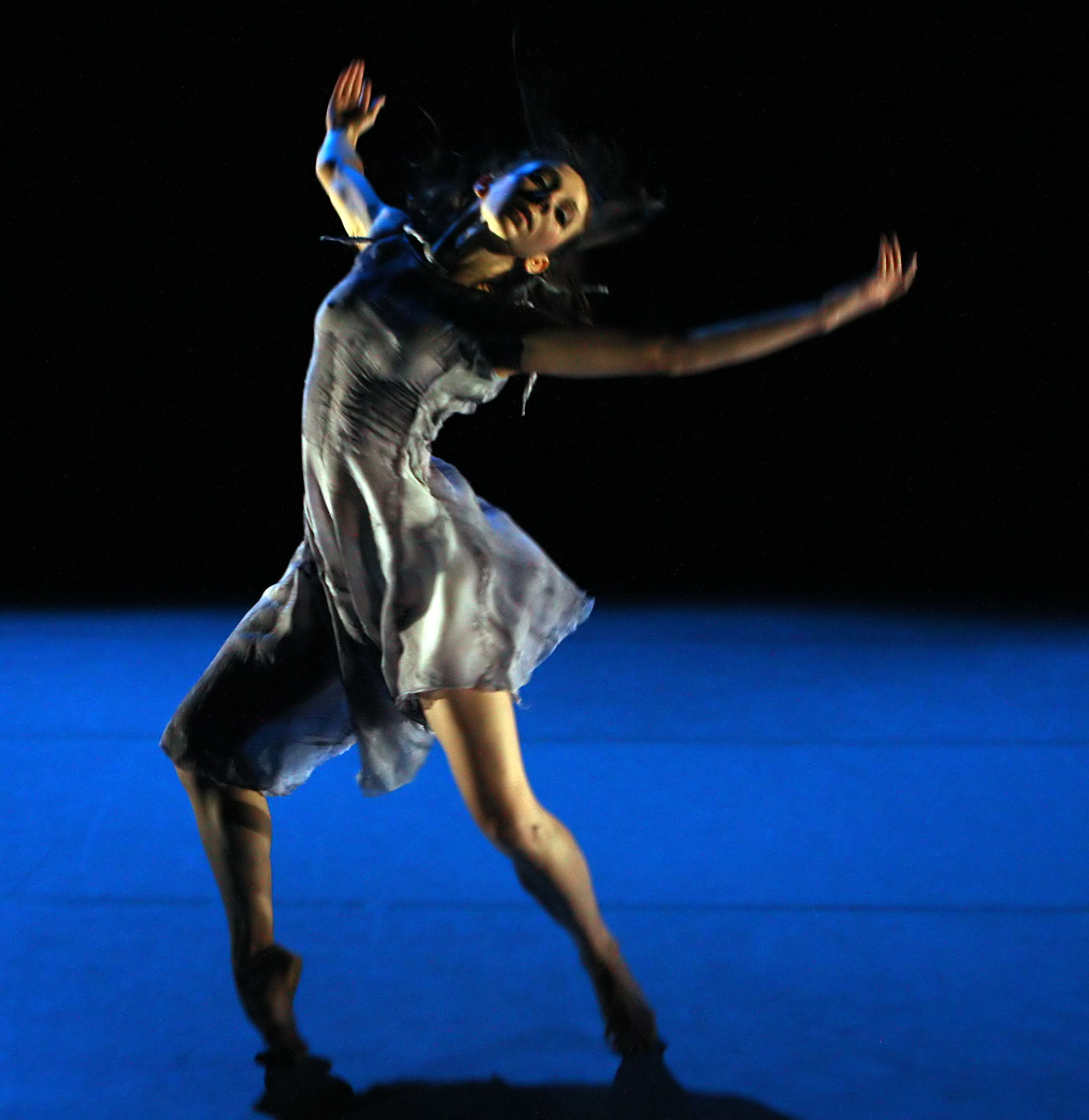 Kate Lyons in Hinterland for National Dance Campy Wales. On stage performance photography shot by Roy Campbell-Moore for NDCW