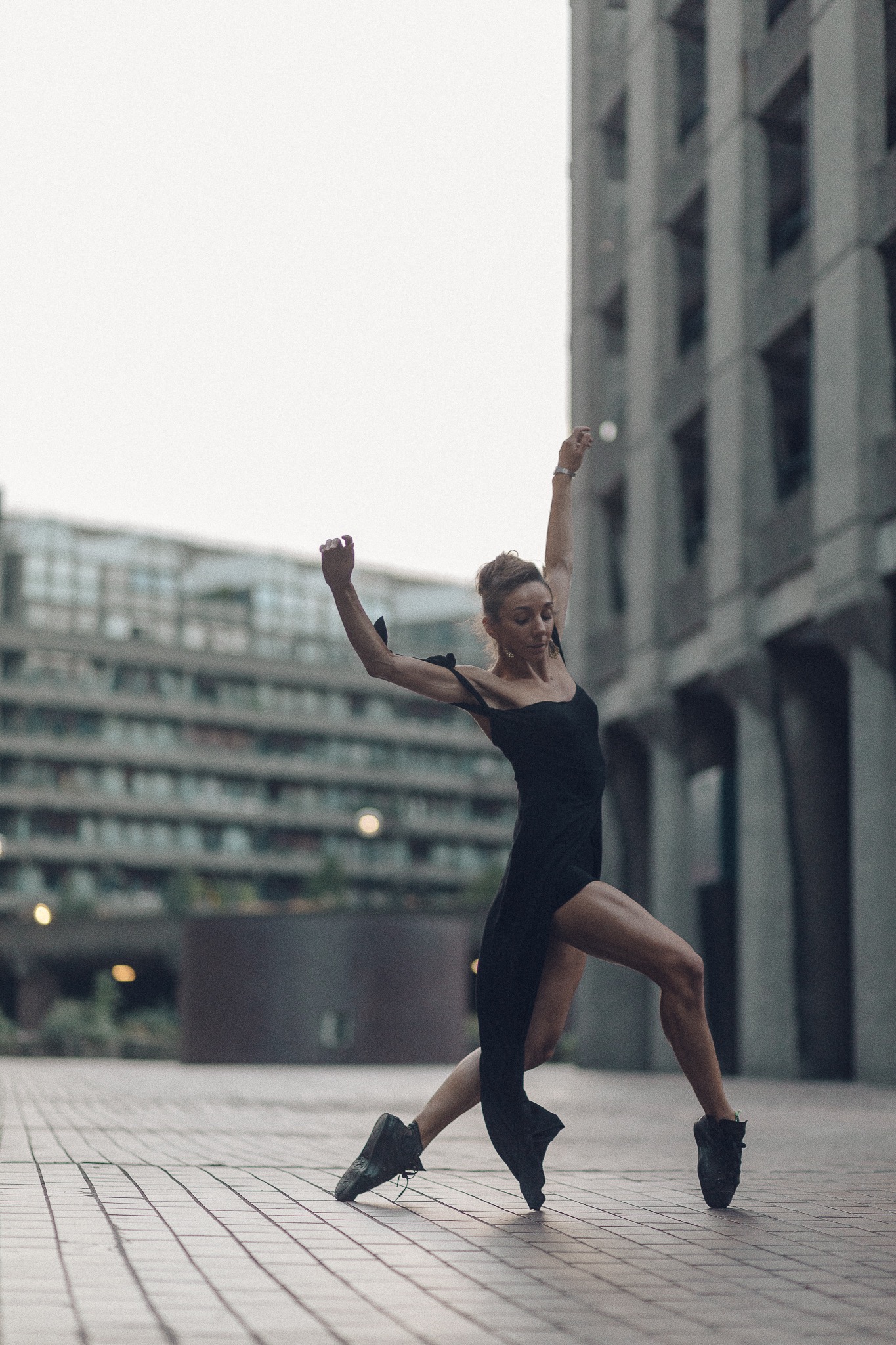 Kate Lyons outside at the Barbican dancing in Converse for Pedestrians on Pointe